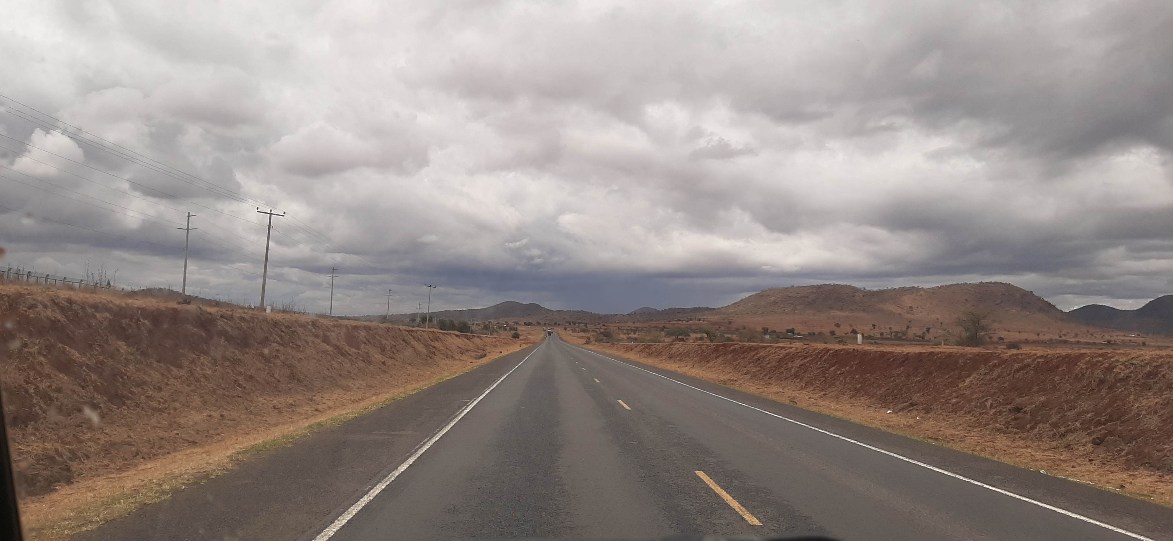 A paved highway crosses dry terrain near Tsavo Park in Kenya in this 2019 file photograph. It is contextual and does not depict the Kanga crash.